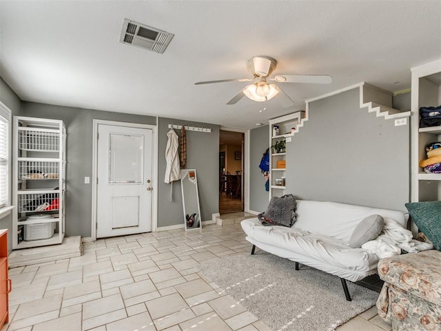 living room with ceiling fan