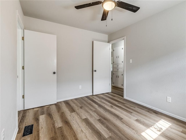 unfurnished bedroom featuring ceiling fan and light hardwood / wood-style floors