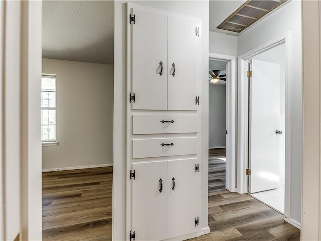 corridor with light hardwood / wood-style flooring