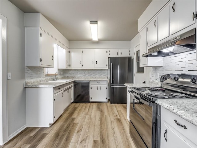 kitchen with black appliances, white cabinets, and sink