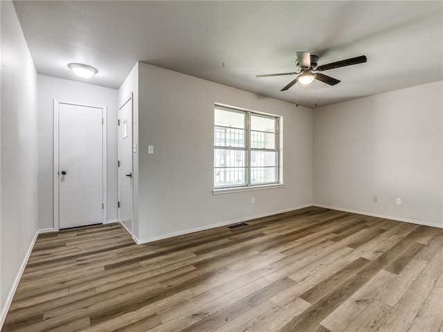 foyer featuring ceiling fan and hardwood / wood-style flooring