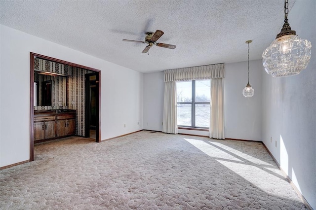 interior space with ceiling fan and a textured ceiling