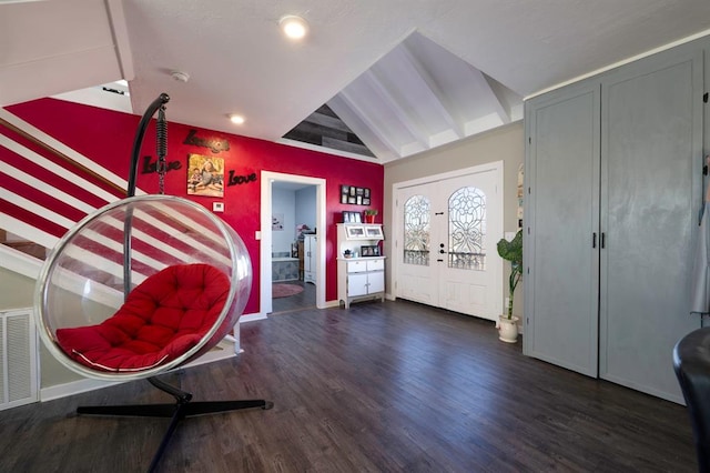 entrance foyer with dark wood-type flooring, lofted ceiling with beams, and french doors