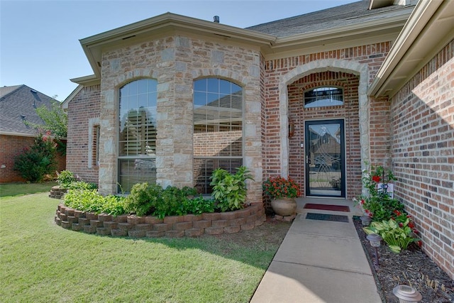 property entrance with a yard