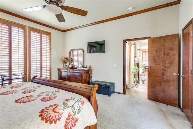 bedroom featuring ceiling fan, light colored carpet, multiple windows, and crown molding