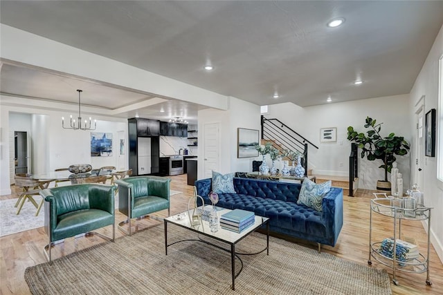 living room with a chandelier and hardwood / wood-style floors