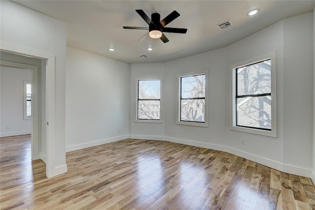 unfurnished room with light wood-type flooring and ceiling fan