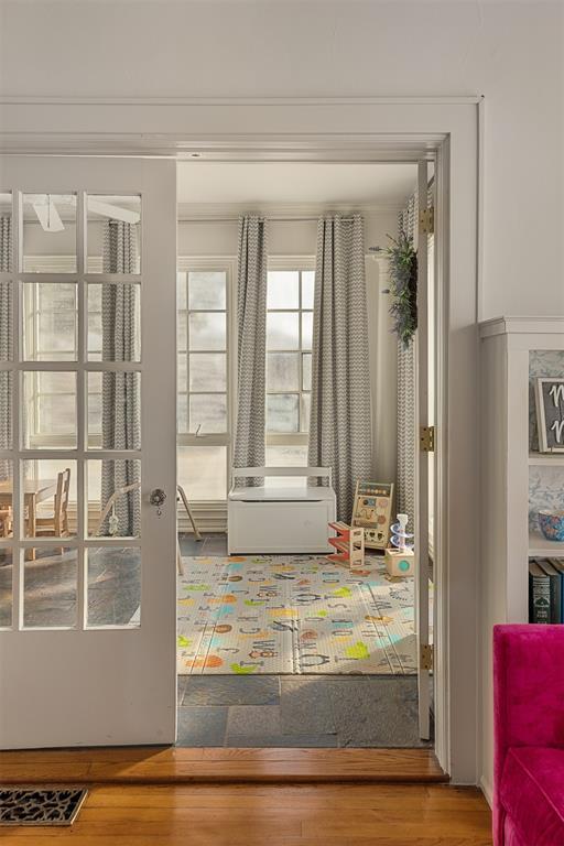 entryway featuring wood-type flooring and french doors