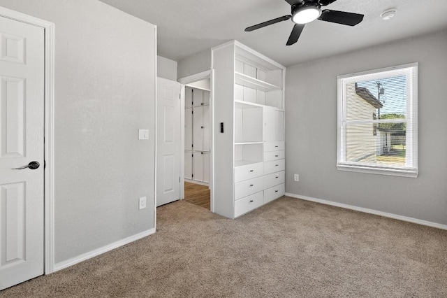 unfurnished bedroom featuring ceiling fan and light colored carpet