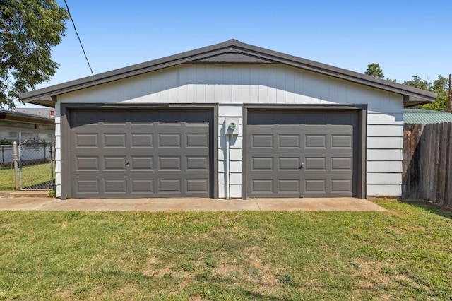 garage featuring a yard