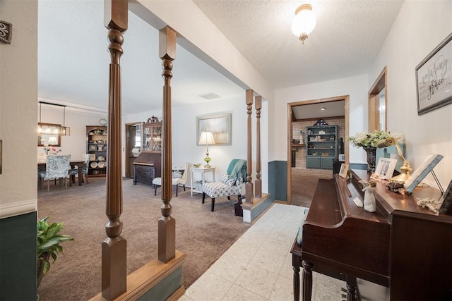 interior space featuring carpet flooring and a textured ceiling