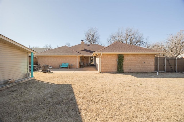 back of house featuring a patio area