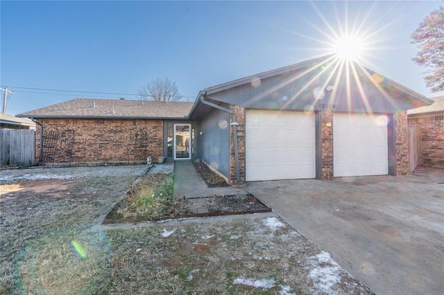 single story home featuring a garage