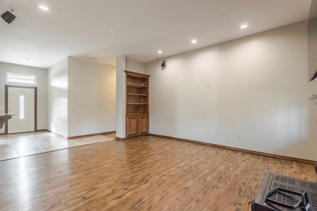 unfurnished living room featuring light hardwood / wood-style flooring