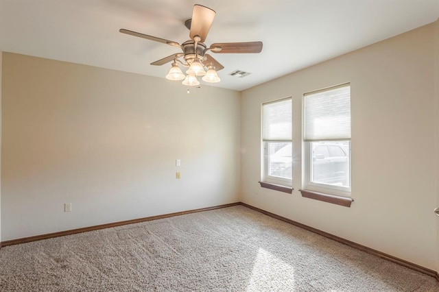 unfurnished room with ceiling fan and carpet floors