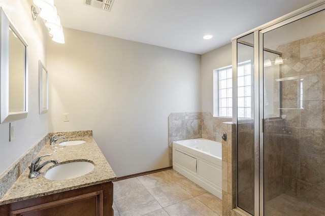 bathroom featuring shower with separate bathtub, tile patterned floors, and vanity