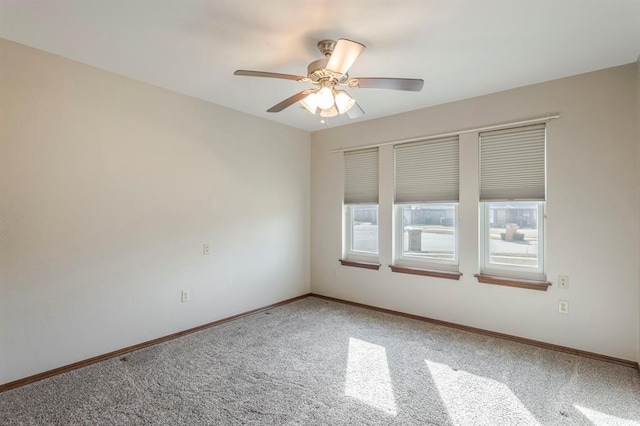 carpeted empty room with ceiling fan