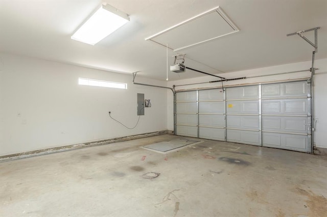 garage featuring a garage door opener and electric panel