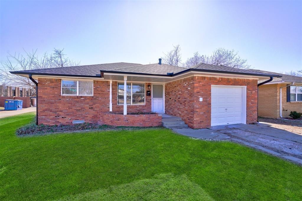 single story home with a garage and a front yard