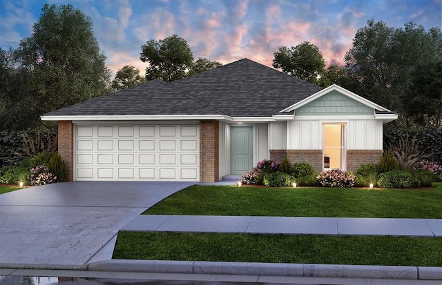 ranch-style house featuring roof with shingles, concrete driveway, a front yard, a garage, and brick siding