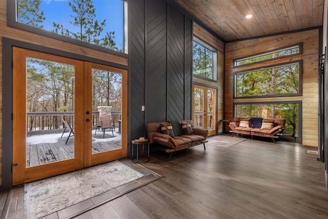 interior space featuring wood ceiling, lofted ceiling, and french doors