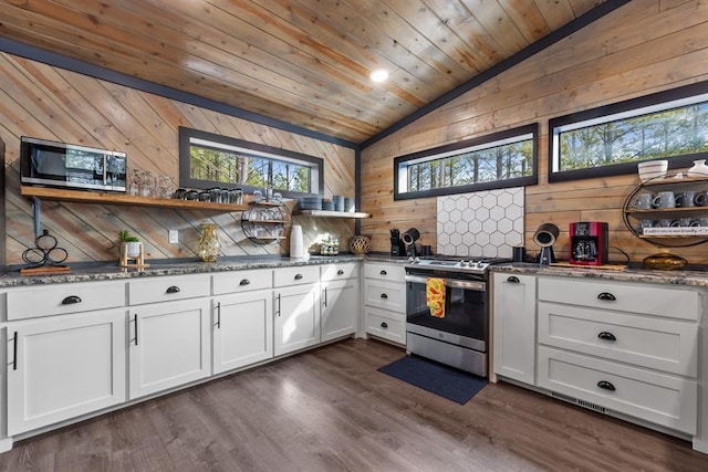 kitchen featuring wooden ceiling, stainless steel appliances, lofted ceiling, and white cabinets