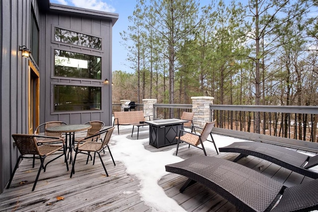 deck featuring an outdoor fire pit