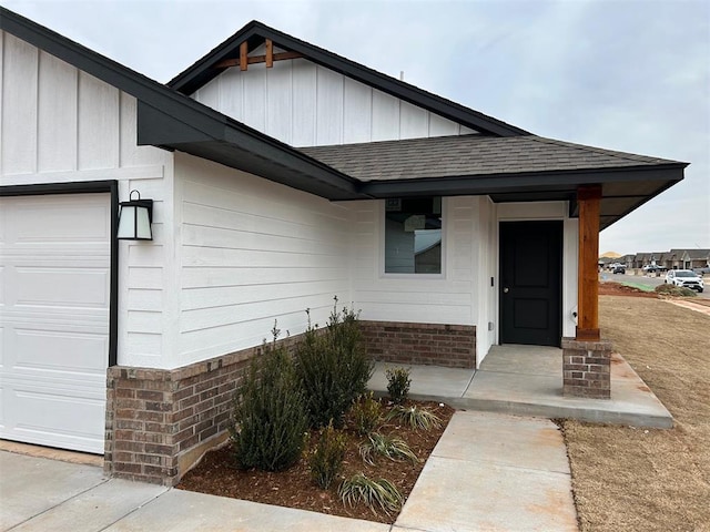 view of exterior entry featuring a garage