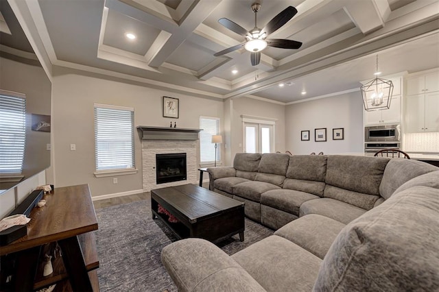 living room with coffered ceiling, dark hardwood / wood-style flooring, ornamental molding, and beamed ceiling