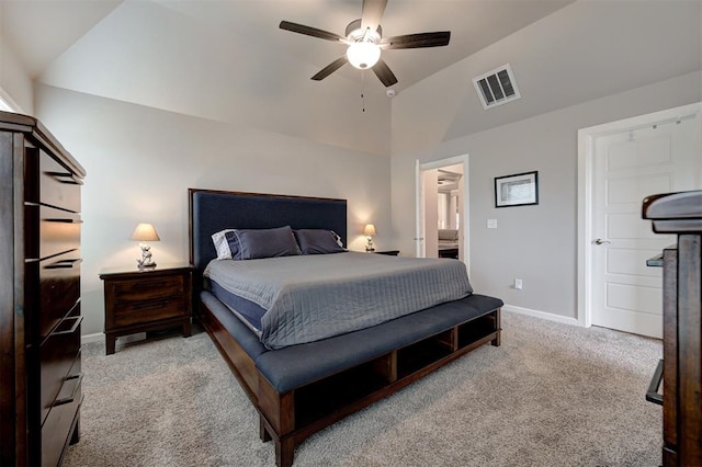 carpeted bedroom featuring vaulted ceiling and ceiling fan