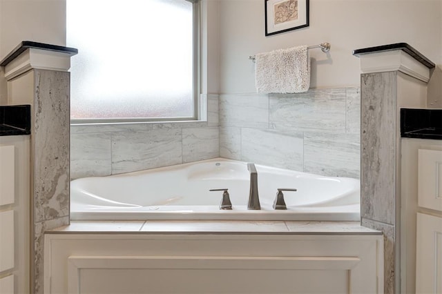 bathroom with tiled bath