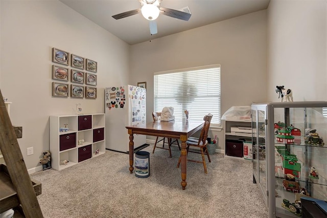 office space with light colored carpet and ceiling fan