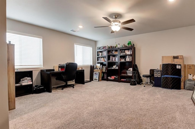 office space featuring carpet floors and ceiling fan