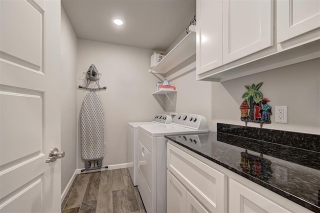 laundry area featuring dark hardwood / wood-style flooring and washing machine and clothes dryer