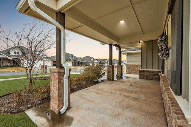 patio terrace at dusk with covered porch