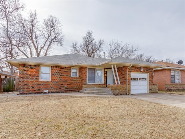 ranch-style home with a garage and a front lawn