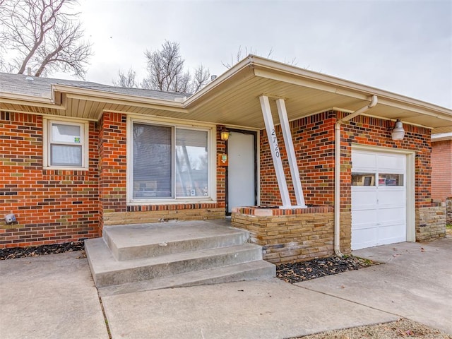 property entrance with a garage