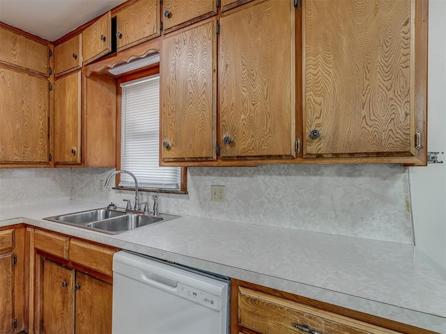 kitchen with dishwasher, sink, and decorative backsplash