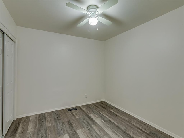 unfurnished room featuring hardwood / wood-style floors and ceiling fan