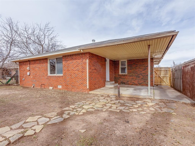 rear view of property featuring a patio area