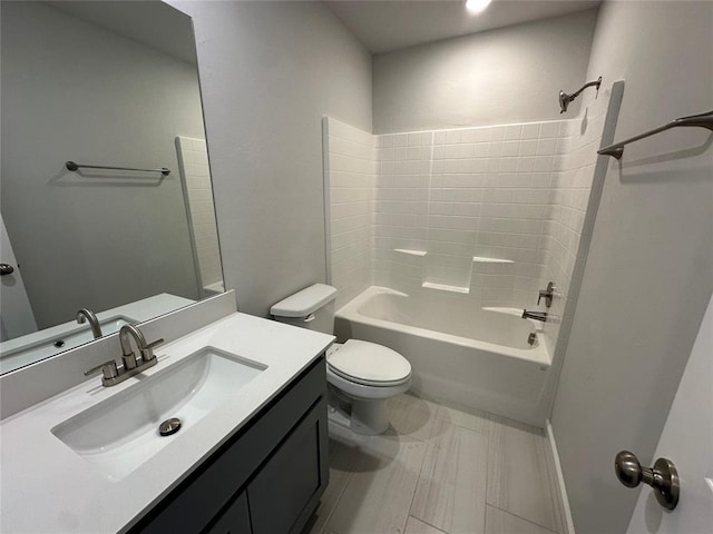 bathroom with toilet, shower / bath combination, and vanity