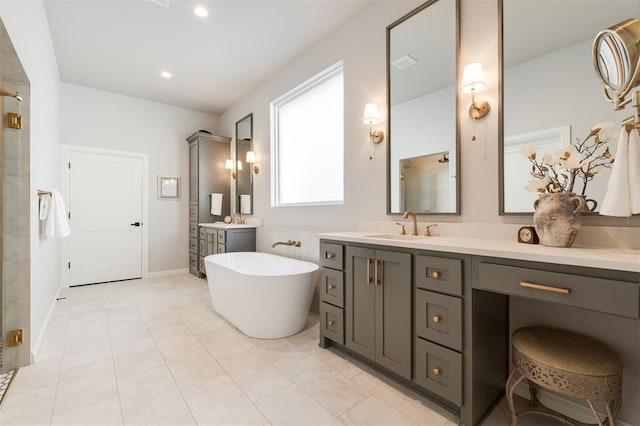 bathroom with tile patterned flooring, shower with separate bathtub, and vanity