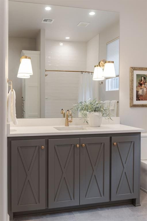 bathroom featuring vanity and walk in shower