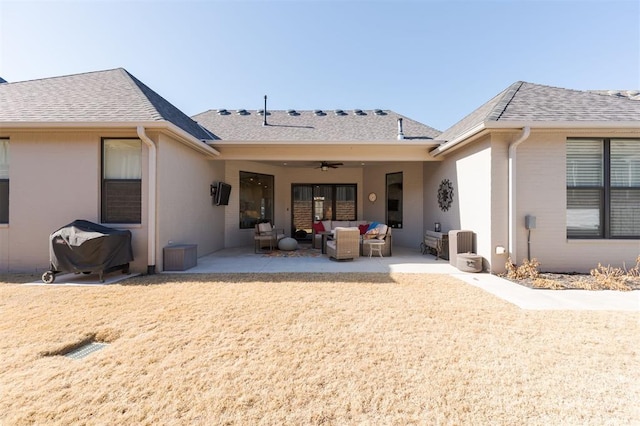 back of house with ceiling fan, a patio area, and outdoor lounge area