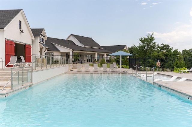 view of pool featuring a patio