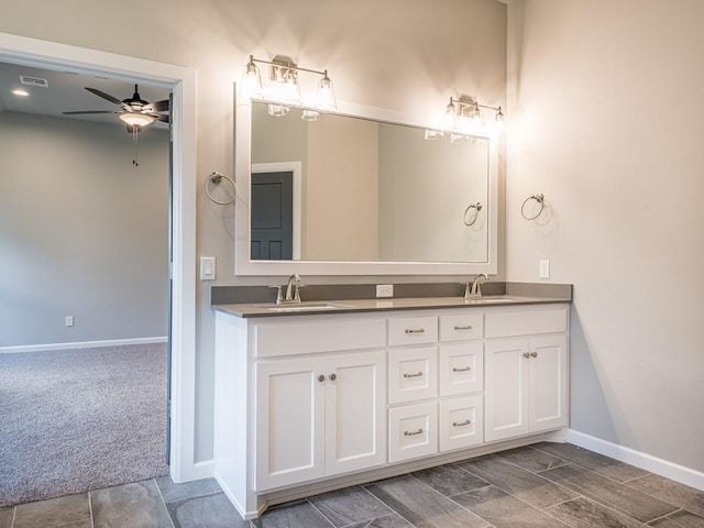 bathroom with ceiling fan and vanity