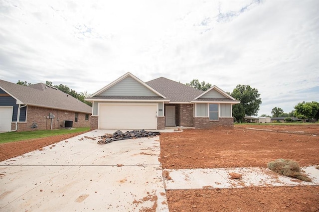 3120 Warwick Way, Moore, OK 73160 - view of front of house with brick siding, concrete driveway, and an attached garage