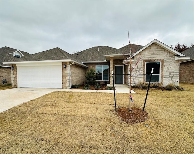 ranch-style house with a garage and a front yard