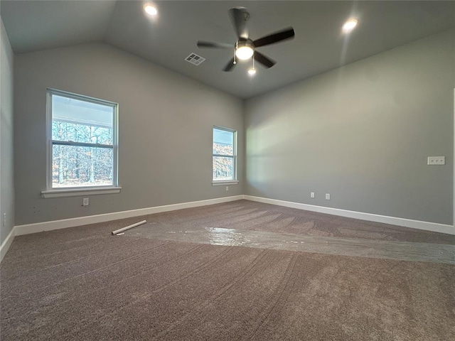 carpeted spare room with ceiling fan and lofted ceiling