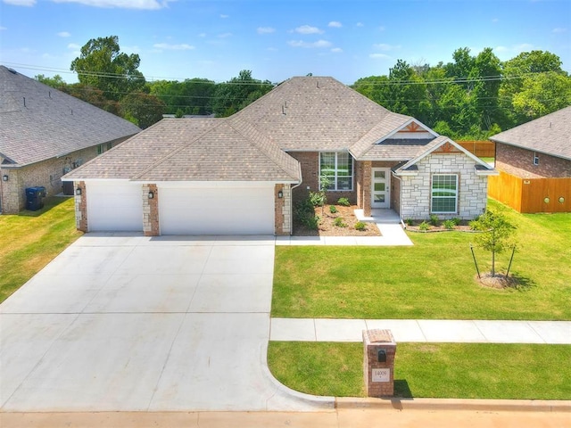 view of front of house with a front lawn and a garage